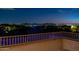 Beautiful nighttime view from the property showcasing the city lights and mountain backdrop at 10843 E Acacia Dr, Scottsdale, AZ 85255