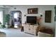 Bright living room features a white cabinet, television, and arched entryway at 1222 E Acoma Dr, Phoenix, AZ 85022