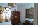Close-up of living room decor, featuring an antique cabinet and framed artwork at 1222 E Acoma Dr, Phoenix, AZ 85022