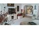 Cozy living room featuring an entertainment center, seasonal decor, and an arched entryway at 1222 E Acoma Dr, Phoenix, AZ 85022