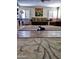 Spacious living room with parquet floors, a neutral sofa, and large area rug at 1222 E Acoma Dr, Phoenix, AZ 85022