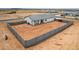 Aerial view of home, backyard with privacy wall and low-maintenance landscaping at 6515 N Loma Ct, Casa Grande, AZ 85194