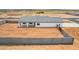 Aerial view of backyard with privacy wall, hardscape and covered patio at 6515 N Loma Ct, Casa Grande, AZ 85194