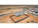 Aerial shot of new home in a desert landscape with a fenced backyard at 6515 N Loma Ct, Casa Grande, AZ 85194