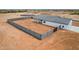 Aerial view of backyard with privacy wall, hardscape and covered patio at 6515 N Loma Ct, Casa Grande, AZ 85194