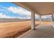Back patio of home featuring an expansive backyard and views of the surrounding desert landscape at 6515 N Loma Ct, Casa Grande, AZ 85194