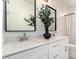 This bathroom features double sinks, white cabinetry, and modern faucets at 6515 N Loma Ct, Casa Grande, AZ 85194