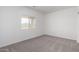 This is a bedroom with one window and gray carpet at 6515 N Loma Ct, Casa Grande, AZ 85194