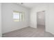 This is a bedroom with a window and a doorway to another room at 6515 N Loma Ct, Casa Grande, AZ 85194