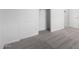 This is a bedroom with gray carpet and an open closet at 6515 N Loma Ct, Casa Grande, AZ 85194
