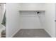 This is a closet with gray carpet and hanging clothes at 6515 N Loma Ct, Casa Grande, AZ 85194