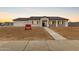 Inviting single-story home with walkway and low-maintenance desert landscaping at 6515 N Loma Ct, Casa Grande, AZ 85194