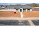 Single-story home featuring desert landscaping and charming curb appeal at 6515 N Loma Ct, Casa Grande, AZ 85194