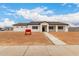 A single Gathering home with neutral color scheme sits on a sunny lot at 6515 N Loma Ct, Casa Grande, AZ 85194
