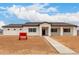 A long view of a new construction single Gathering home with neutral color scheme at 6515 N Loma Ct, Casa Grande, AZ 85194