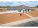 Single-story home with desert landscaping and charming curb appeal with mountain views at 6515 N Loma Ct, Casa Grande, AZ 85194