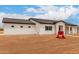 Side view of single-story home with neutral color palette and desert landscaping at 6515 N Loma Ct, Casa Grande, AZ 85194