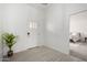 Bright and open foyer with neutral paint and flooring at 6515 N Loma Ct, Casa Grande, AZ 85194
