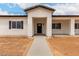 A beautifully staged front entrance to a single Gathering new construction house at 6515 N Loma Ct, Casa Grande, AZ 85194