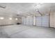 Spacious three car garage featuring ample room for parking and storage with automatic garage doors at 6515 N Loma Ct, Casa Grande, AZ 85194