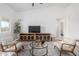 Staged living room with lots of natural light and hardwood floors at 6515 N Loma Ct, Casa Grande, AZ 85194