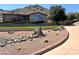 Charming home with desert landscaping and a lush green lawn, offering curb appeal at 7147 N Red Ledge Dr, Paradise Valley, AZ 85253