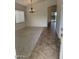 Spacious living room featuring neutral carpet, modern lighting fixture, and seamless flow to other areas at 8659 E Mescal St, Scottsdale, AZ 85260