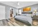 Comfortable bedroom with wood-look flooring and attached bath for convenience at 8972 E Arizona Park Pl, Scottsdale, AZ 85260