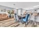 A bright open-concept dining and living area with views into the kitchen and adjacent breakfast bar at 8972 E Arizona Park Pl, Scottsdale, AZ 85260
