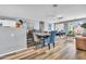 Wide open-concept living and dining area with modern furniture and views into the kitchen at 8972 E Arizona Park Pl, Scottsdale, AZ 85260