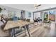 Spacious open-concept living and dining area with hardwood floors and neutral walls at 8972 E Arizona Park Pl, Scottsdale, AZ 85260