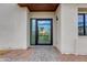 Close-up of front door with stone pathway showcasing the modern design and inviting entrance at 100 W Northern Ave # 15, Phoenix, AZ 85021