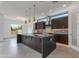 Modern kitchen featuring a large island, pendant lighting, stainless steel appliances, and sleek countertops at 100 W Northern Ave # 15, Phoenix, AZ 85021
