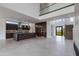 Open floor plan showing the kitchen with an oversized island, sleek cabinetry, and modern lighting fixtures at 100 W Northern Ave # 15, Phoenix, AZ 85021