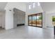 Spacious living room features a modern fireplace, large windows, and neutral tones throughout at 100 W Northern Ave # 15, Phoenix, AZ 85021