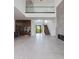 Open-concept living space features a modern staircase, fireplace, and gourmet kitchen at 100 W Northern Ave # 15, Phoenix, AZ 85021