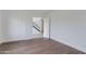 Bright room featuring hardwood floors and an open doorway, creating a seamless transition to other spaces at 100 W Northern Ave # 15, Phoenix, AZ 85021