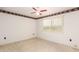 Neutral carpeted bedroom with white walls, ceiling fan, and window with blinds at 10418 W Corte Del Sol Oeste --, Sun City, AZ 85351