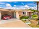 Charming brick home with manicured lawn and desert landscaping under a sunny sky at 10418 W Corte Del Sol Oeste --, Sun City, AZ 85351