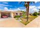 Charming brick home with manicured lawn and desert landscaping under a sunny sky at 10418 W Corte Del Sol Oeste --, Sun City, AZ 85351