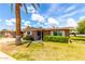Charming brick home with manicured lawn and desert landscaping under a sunny sky at 10418 W Corte Del Sol Oeste --, Sun City, AZ 85351
