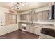 Well-lit kitchen with an ample number of cabinets, and newer appliances at 10418 W Corte Del Sol Oeste --, Sun City, AZ 85351