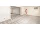Bright living room with neutral carpet, white walls, and open layout at 10418 W Corte Del Sol Oeste --, Sun City, AZ 85351