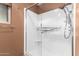 Bright bathroom shower with glass door, white tile, and modern fixtures at 10418 W Corte Del Sol Oeste --, Sun City, AZ 85351