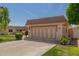 Beautiful single story home with an attached two-car garage and mature landscaping for an inviting look at 10461 W Hutton Dr, Sun City, AZ 85351