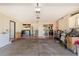 Spacious garage offers ample storage and parking, with additional space for projects and organization at 10461 W Hutton Dr, Sun City, AZ 85351