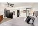Spacious main bedroom featuring walk-in closet, with neutral decor and a ceiling fan at 10461 W Hutton Dr, Sun City, AZ 85351