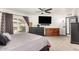 Bright main bedroom with slider to yard, and neutral decor creates a relaxing space at 10461 W Hutton Dr, Sun City, AZ 85351