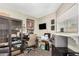 Functional home office with desk, storage, and natural light from a window; ideal for work or study at 10461 W Hutton Dr, Sun City, AZ 85351