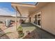 Covered patio includes a dining set, barbecue, and easy access to the home's interior at 10461 W Hutton Dr, Sun City, AZ 85351
